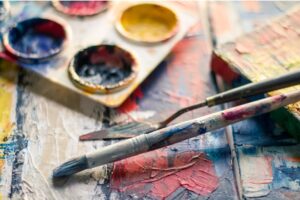 Paint pots, paintbrush, and paint spatula