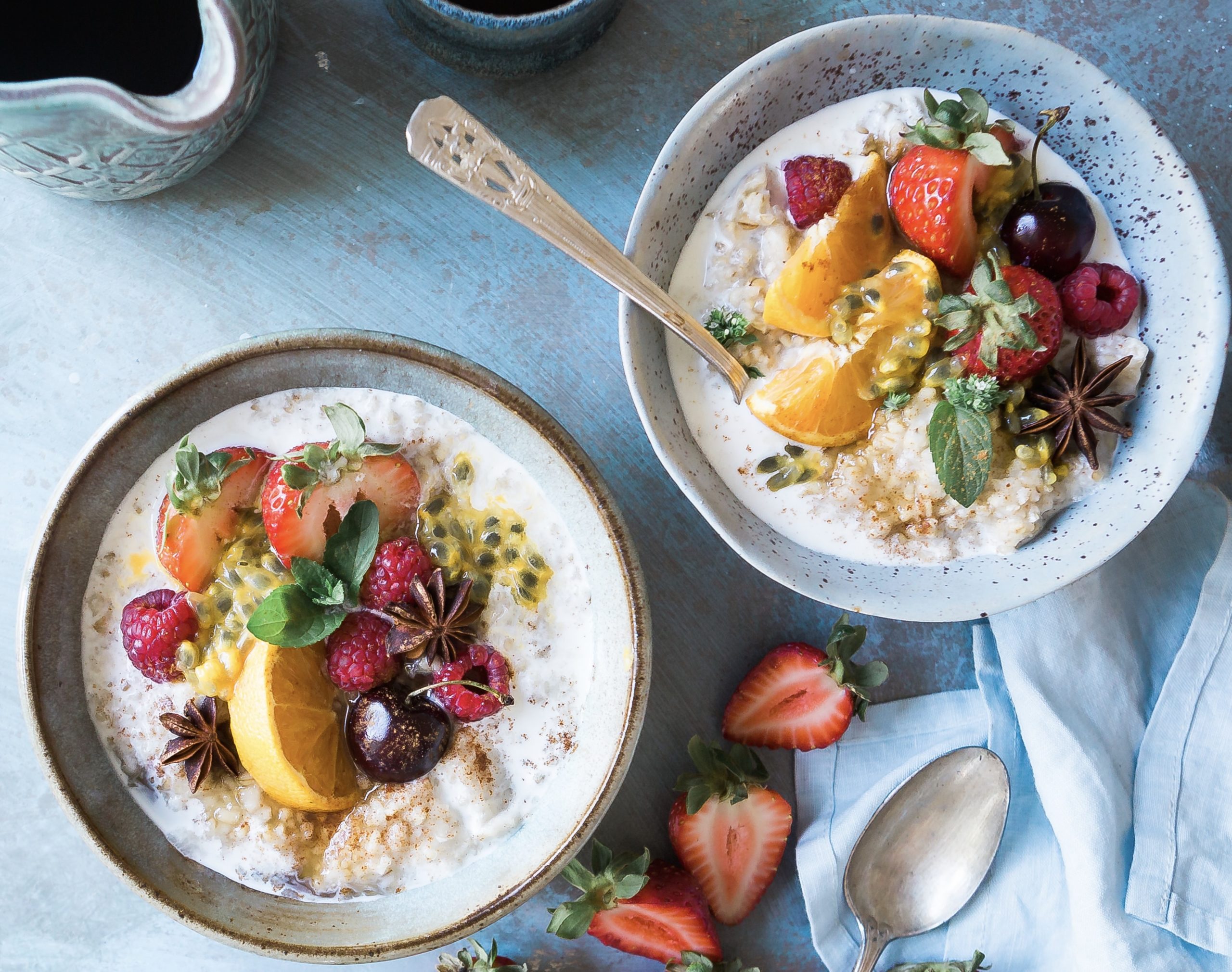 Bowls of yogurt topped with fruit demonstrate a healthy diet.